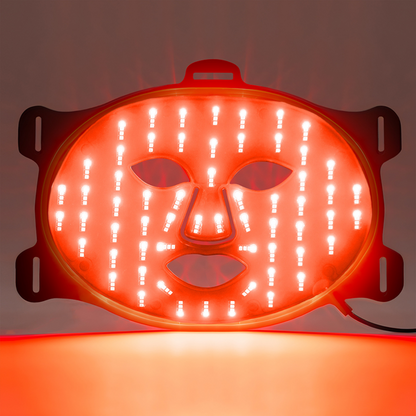 Red LED face-shaped light on a dark background