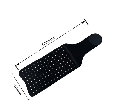 Black paddle with measurements on a white background