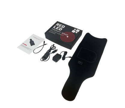 Black heating pad with packaging and accessories on a white background